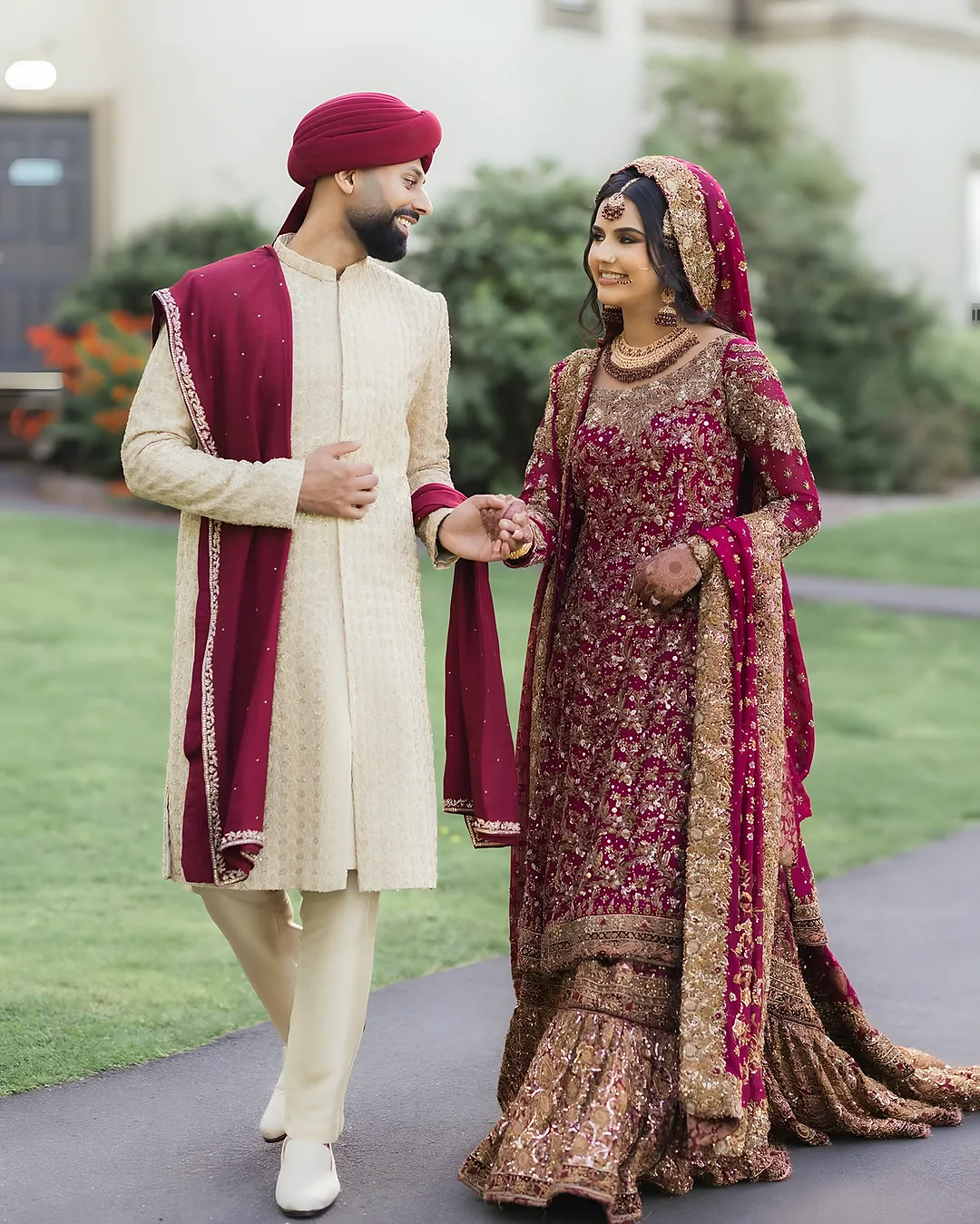 Couple walking hand in hand along a path