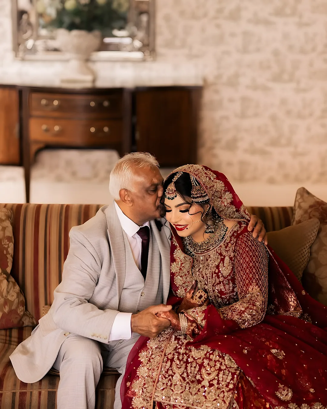 Father and bride share a quiet moment